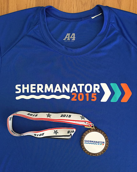 My age group medal along with the great race shirt. Sure to be a new favorite of mine.
