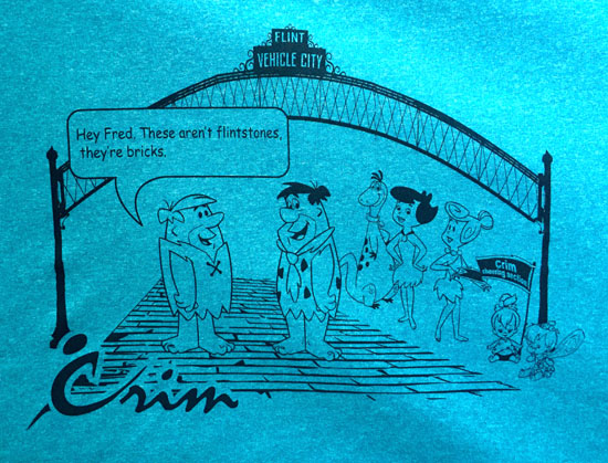 A cute Flintstones shirt that refers to the bricks at the start and finish of the race.