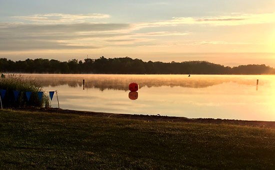 Between the fog on the water and the sunrise, the lake looked beautiful