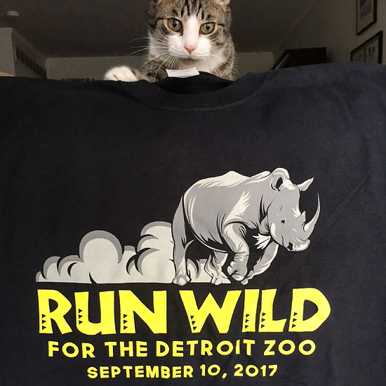 Romeo always wants to be a part of the action, so of course he was there to photo bomb my picture of the race shirt